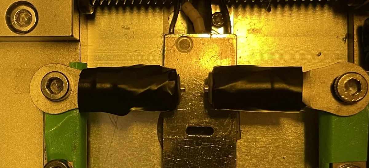 Two taped 1 mm cylinder magnets face to face on the force bench.