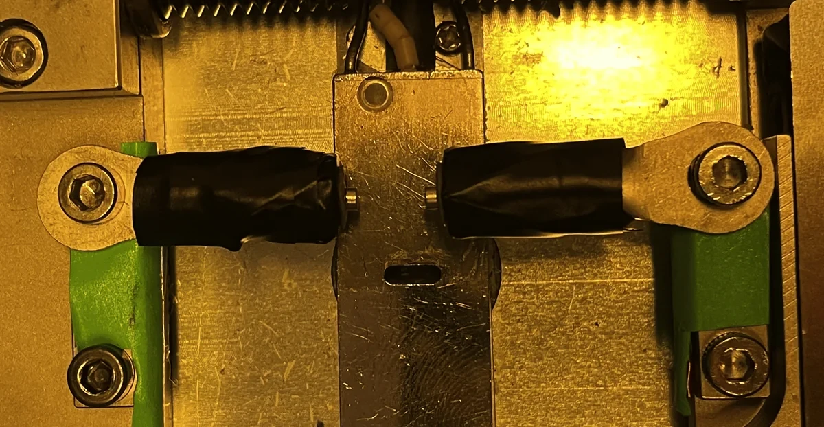 Two taped 2 mm cylinder magnets face to face on the force bench.
