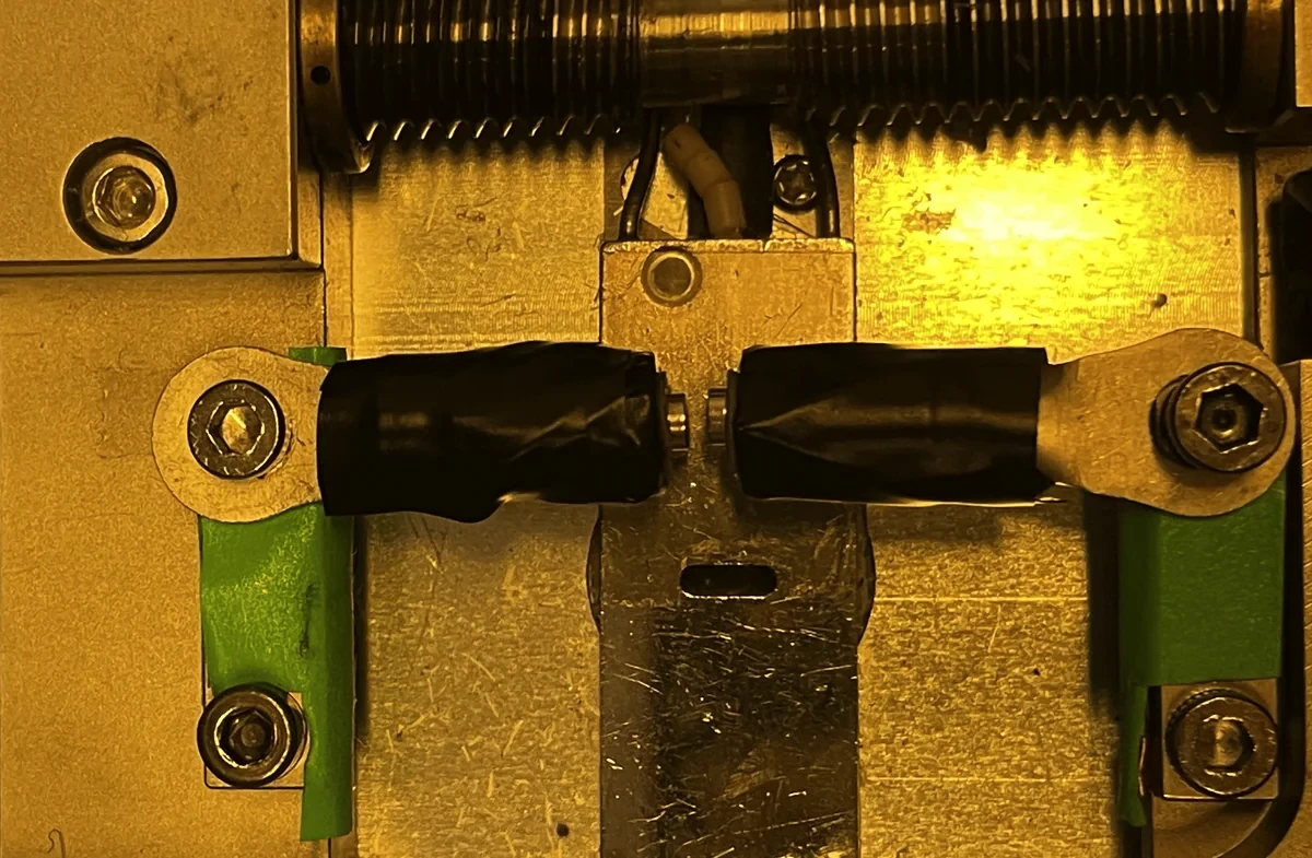 Two taped 3 mm cylinder magnets face to face on the force bench.